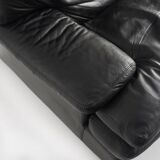Black leather two-seater sofa. Roche Bobois edition. France, 1980s.