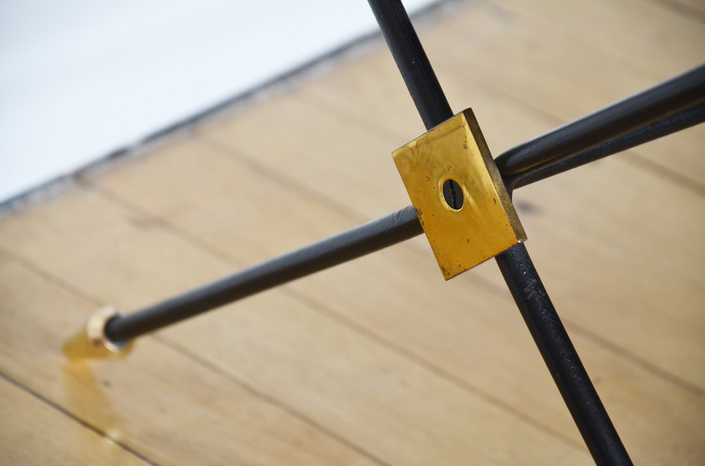 Black glass and brass coffee table in the 1960s