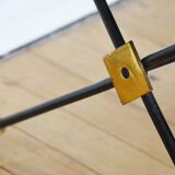Black glass and brass coffee table in the 1960s