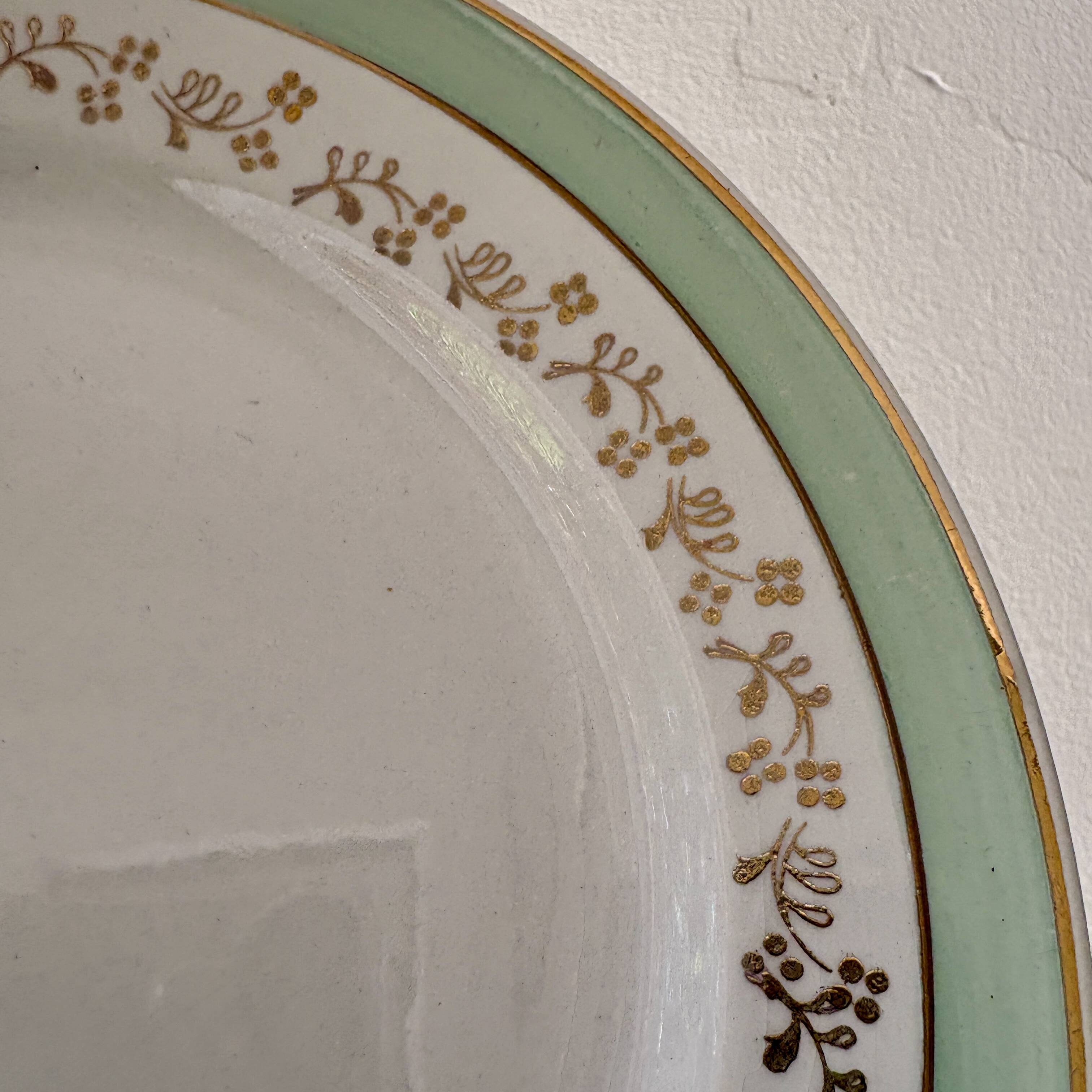 Set of 12 white, mint and gold flat plates, Mosèle de Lunéville
