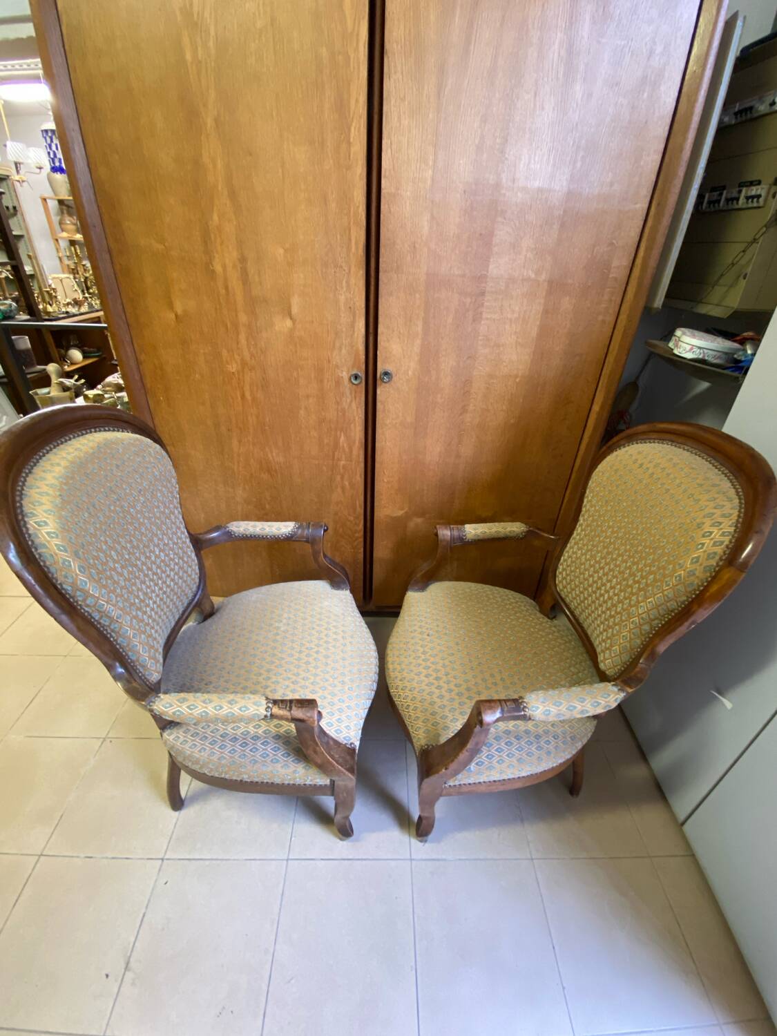 Two Louis XV style wooden and fabric armchairs