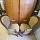 Two Louis XV style wooden and fabric armchairs