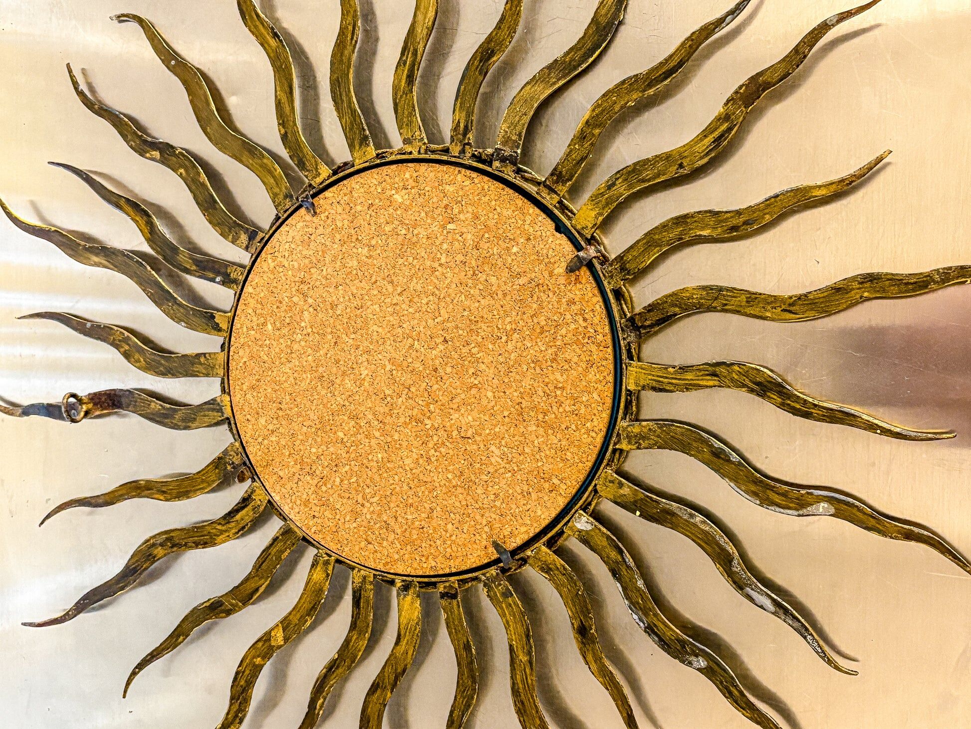 French sunburst starburst mirror in gilt iron, 1950s