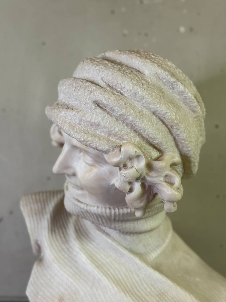 Alabaster bust of a young girl with a turtleneck, signed Caloni, Italy circa 1900