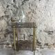 Brass sofa tip and smoked glass