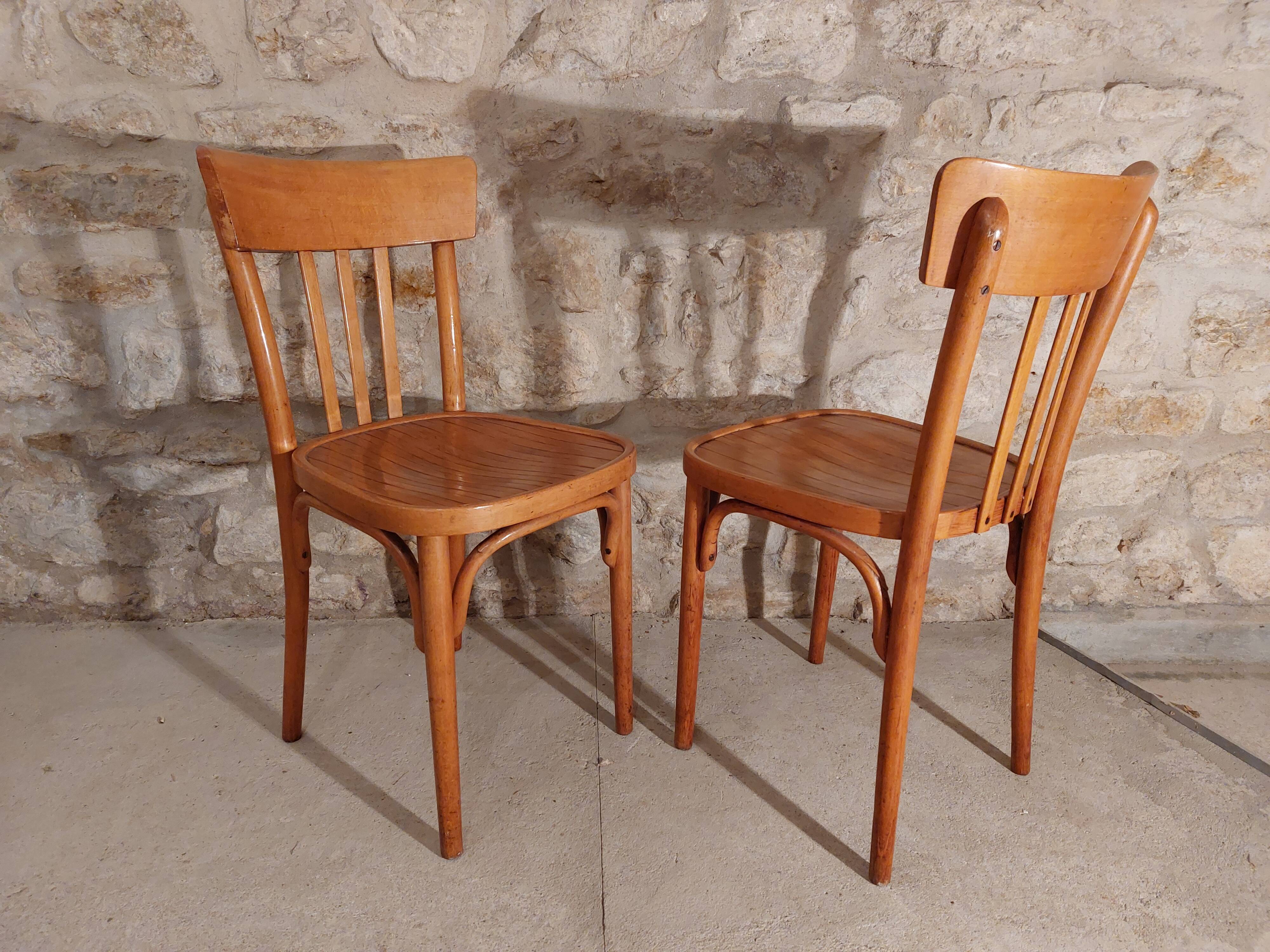 Pair of honey-colored bistro chairs