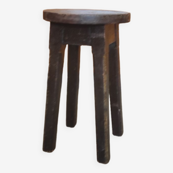 Old vintage farm stool in tripod fir