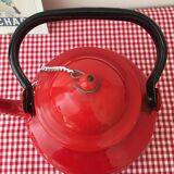Red enameled metal teapot with chain