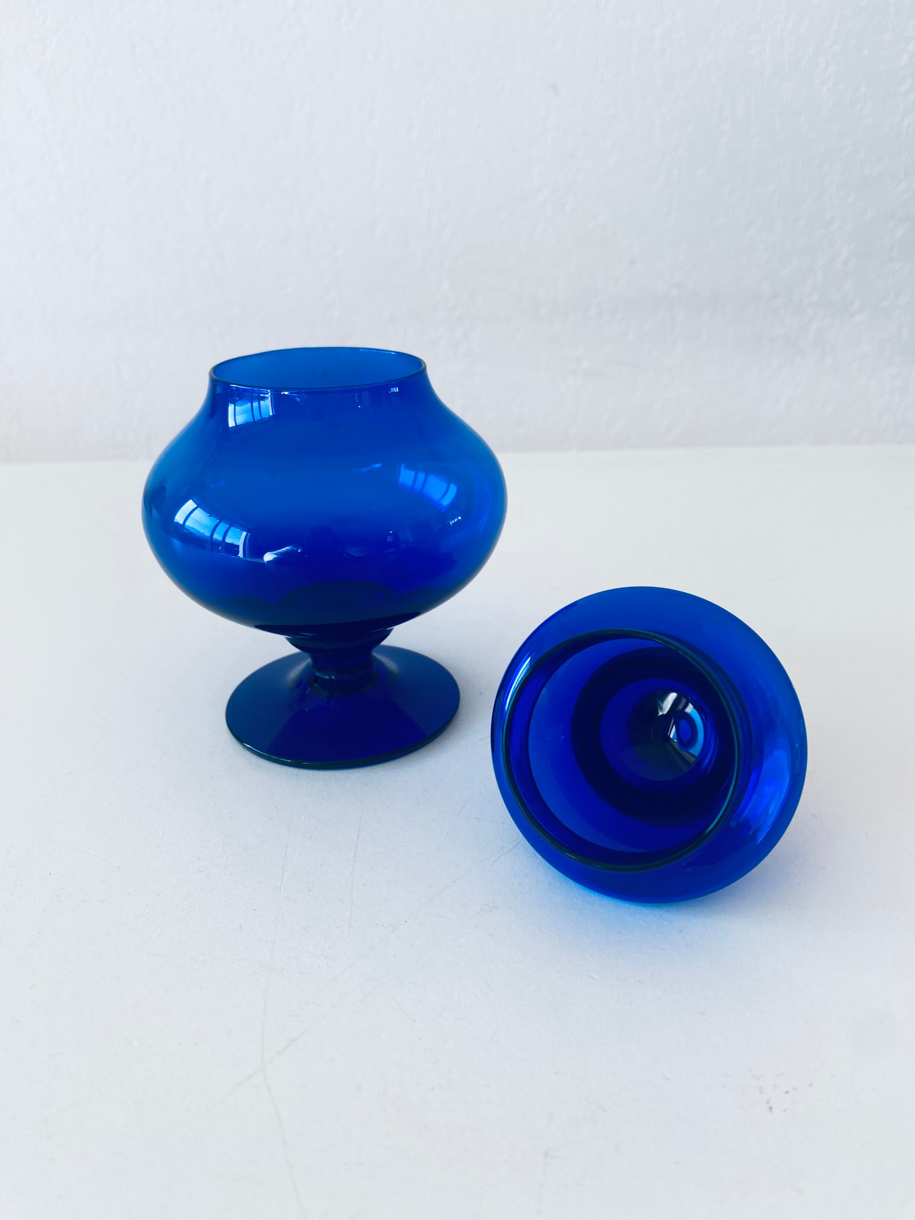 Blue glass apothecary shaped bottle