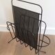 Black lacquered metal and perforated metal magazine rack designed by Mathieu Matégot 50.