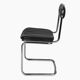 Tube chair with chrome steel base and seat and backrest made of soft black leatherette.