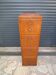 Antique oak filing cabinet with 4 drawers.