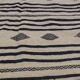 Traditional hand-woven beige and black carpet