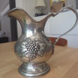 Pewter pitcher decorated with bunch of grapes