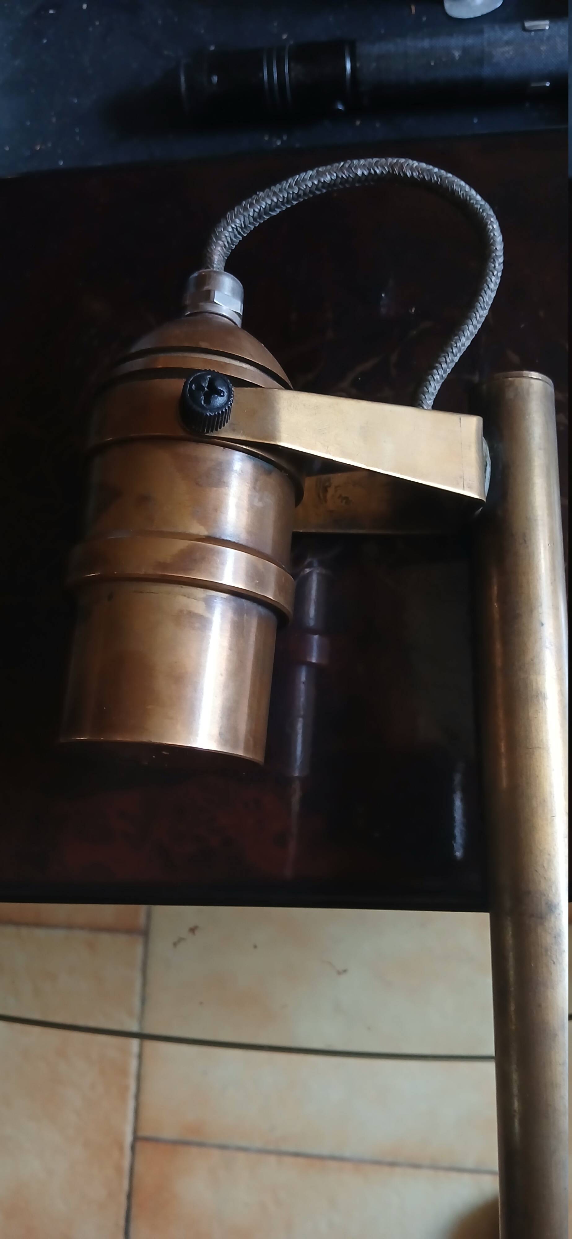 Bronze boat lamp on wooden base