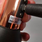 A pair of wall lamps from Eglo, in copper color and black.