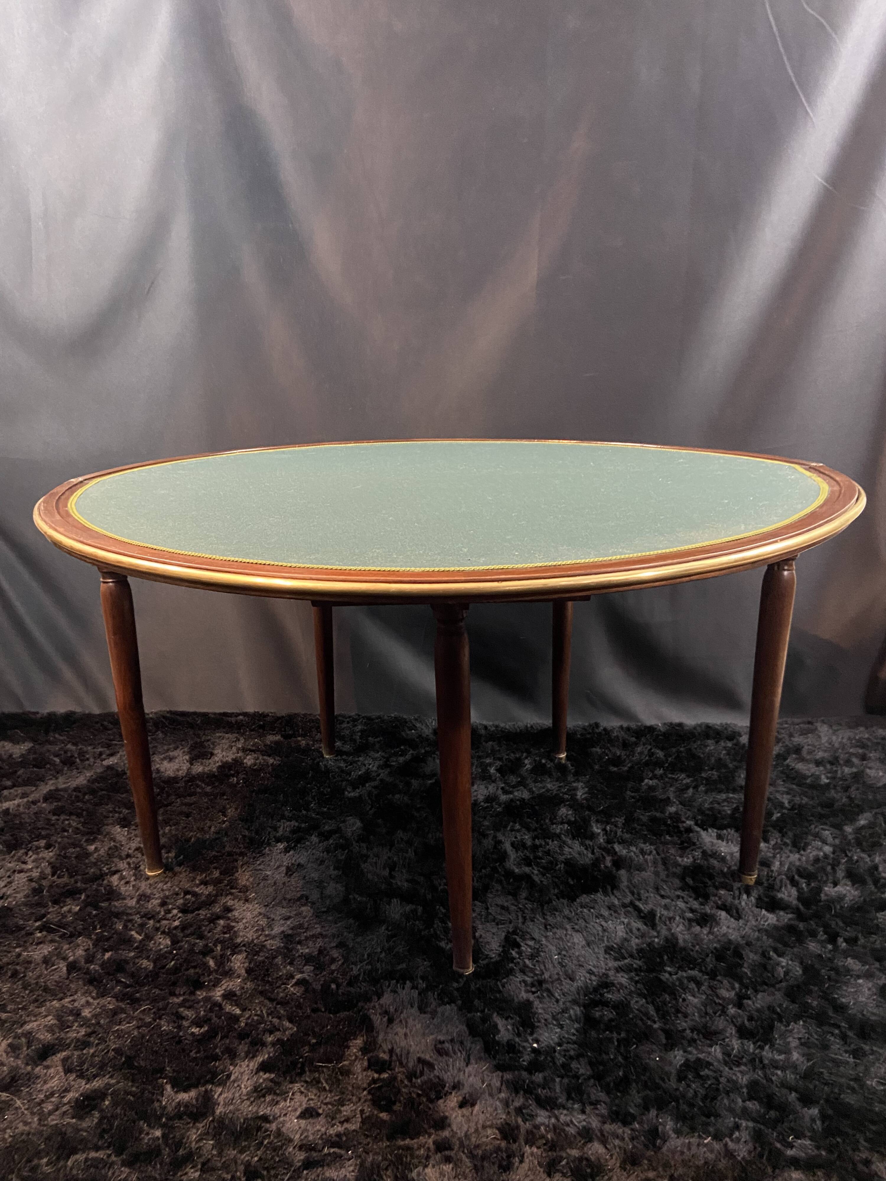 A Louis XVI period mahogany half-moon table forming a console/games table