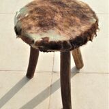 Rustic tripod stool seat covered with goatskin
