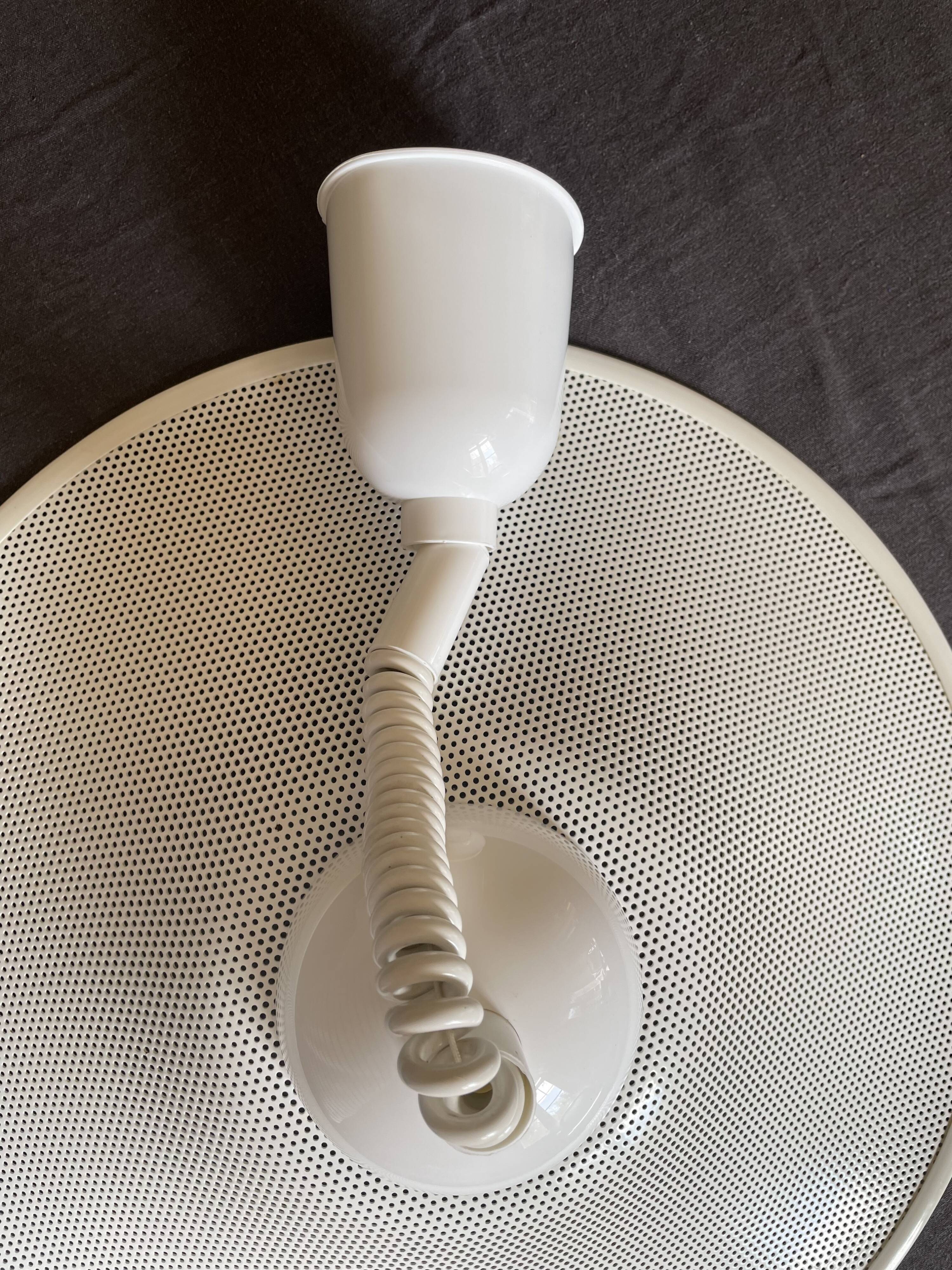 Suspension of the 80s in perforated white metal