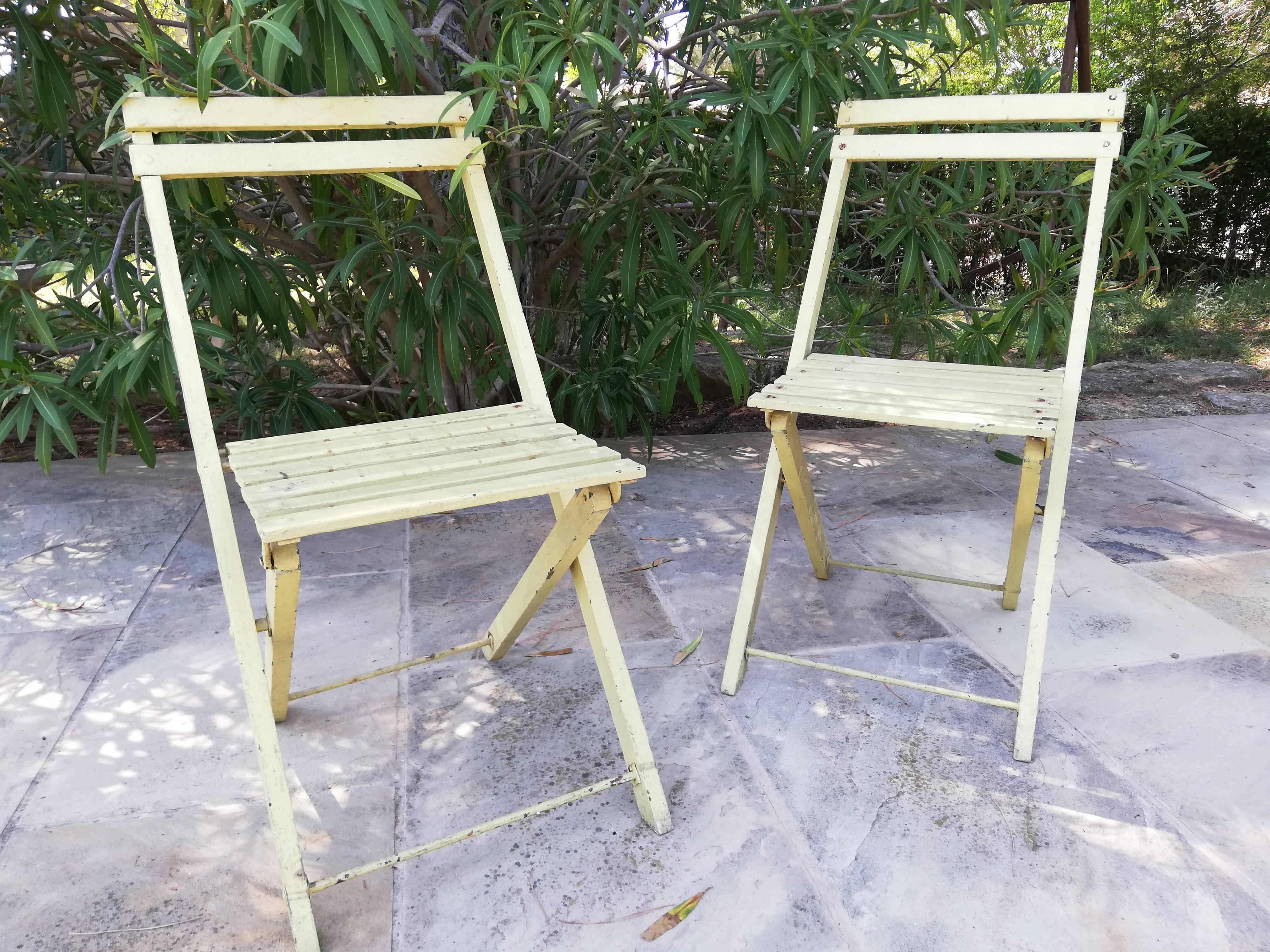 Two folding garden chairs