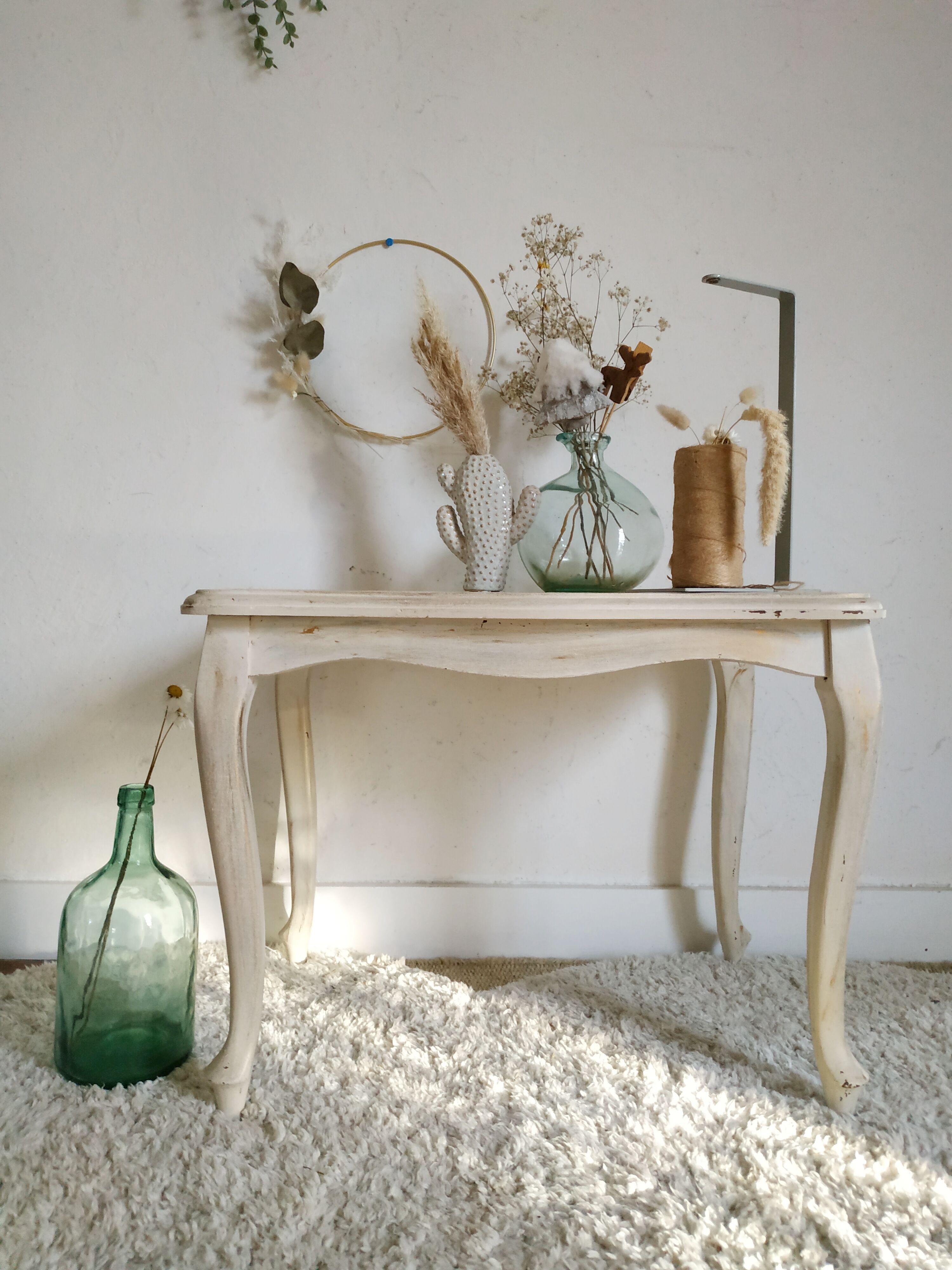 Old patinated coffee table and curved feet