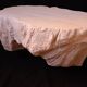Design coffee table with travertine rock effect — unique piece hand-sculpted.