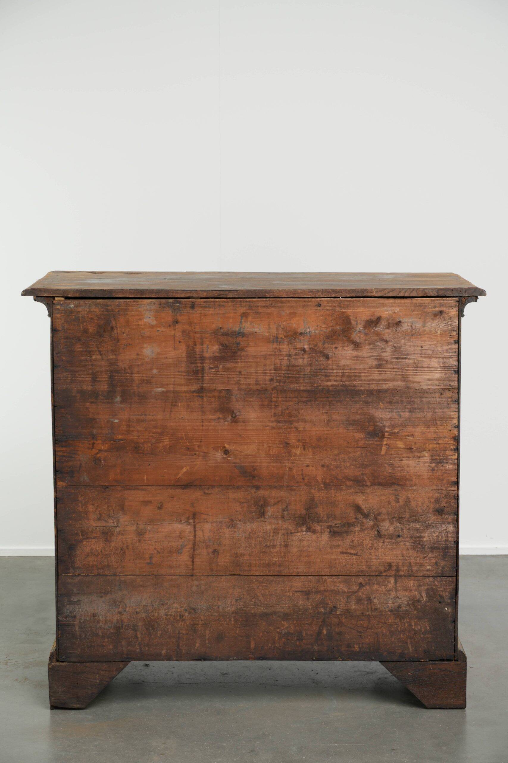 Richly carved English oak chest of drawers from the 18th century