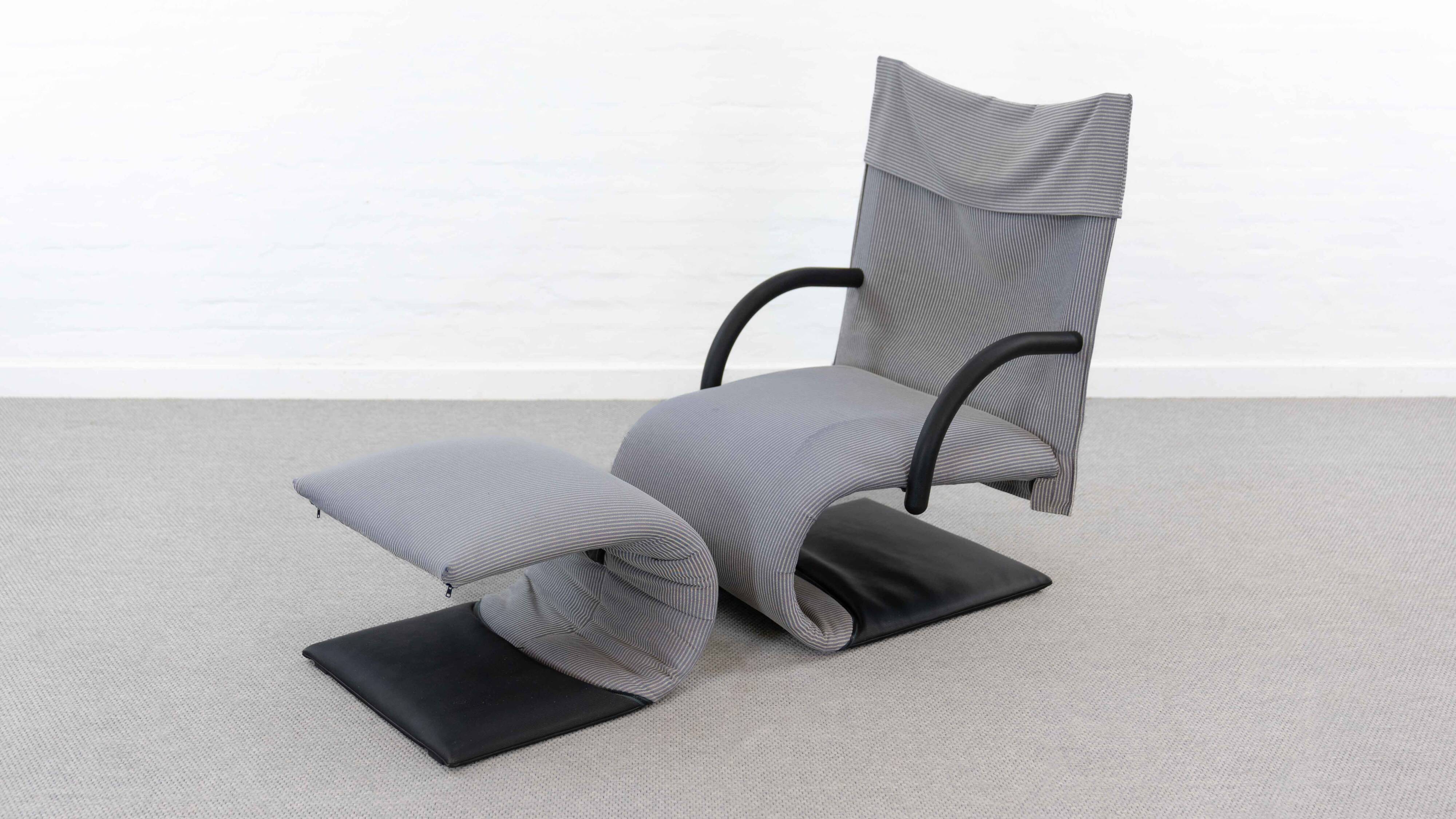 Zen easy chair with footrest by claude brisson for ligne roset