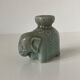 Porcelain candle holder and celadon cover in the shape of an elephant