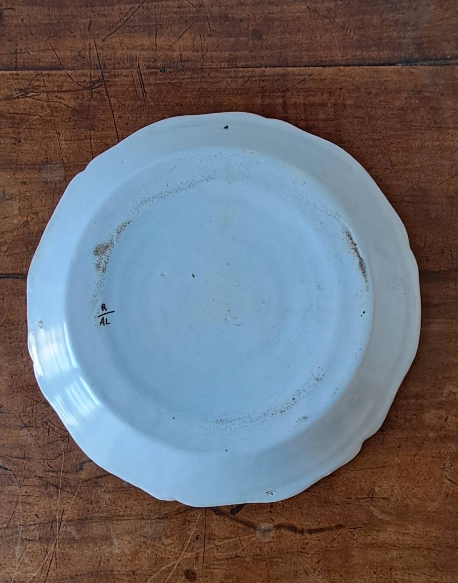 Decorative plate in the 18th-century style. Decoration of a stylised rooster.