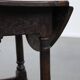 Antique English drop-leaf joint stool made of oak from the 18th century