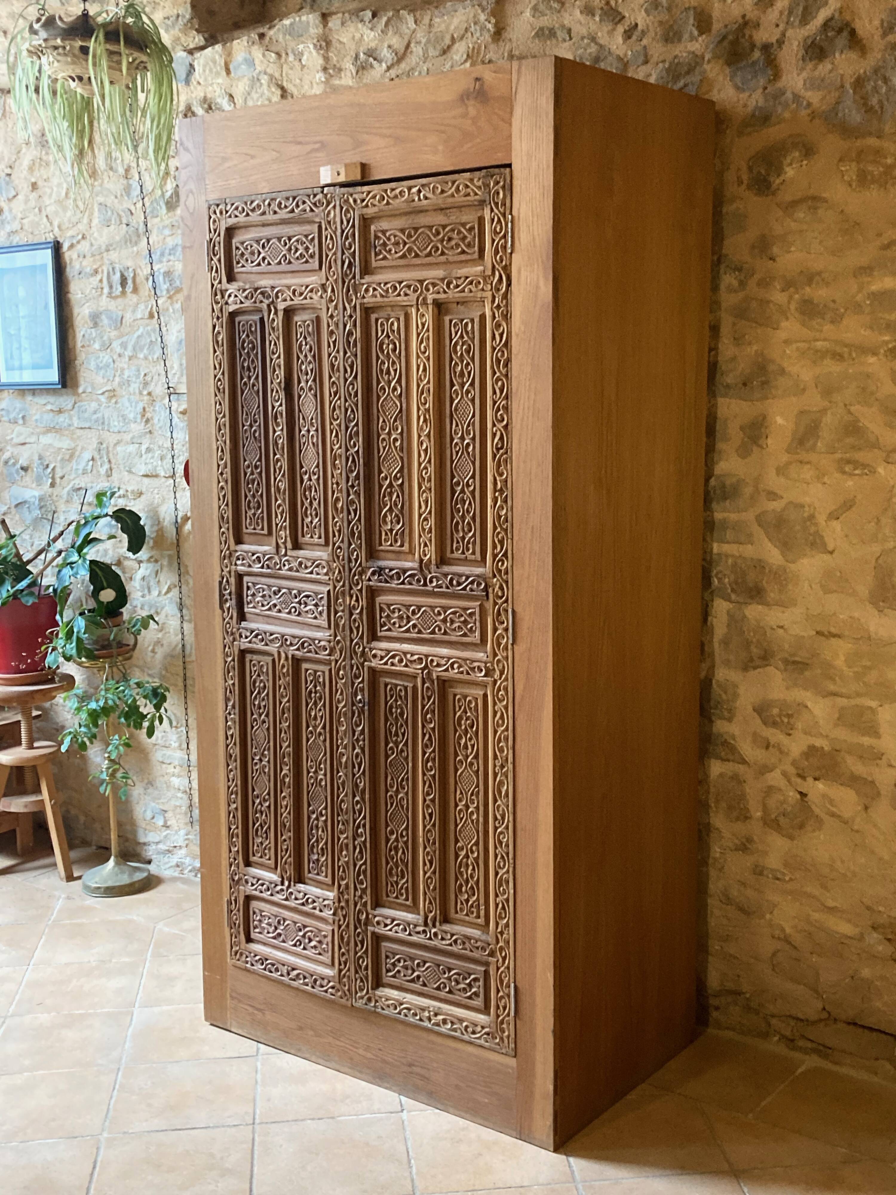 Wardrobe with exotic carved doors