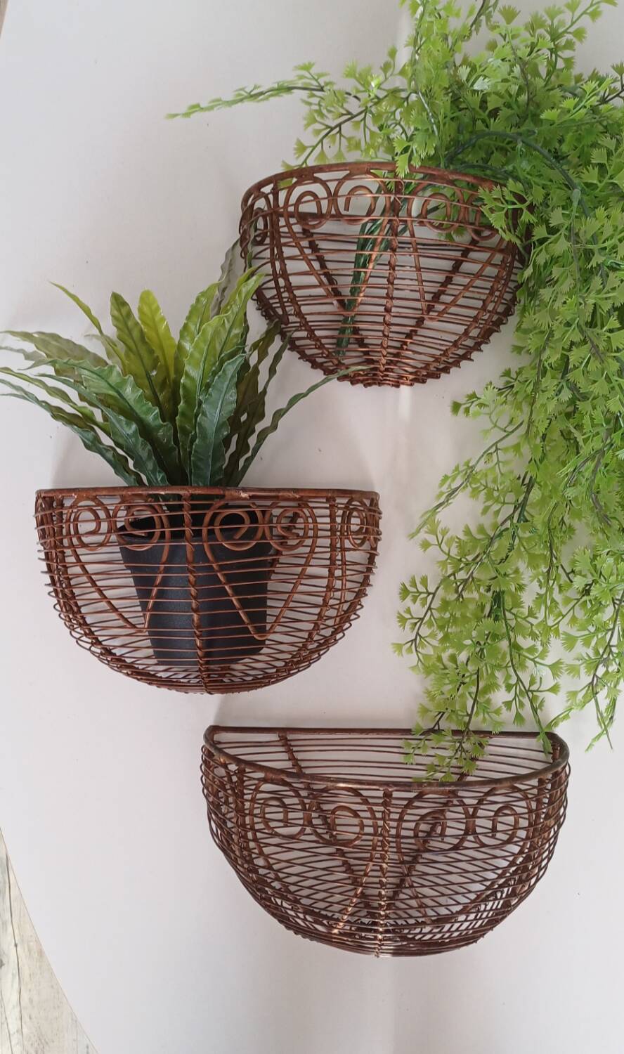 Wall-mounted plant baskets