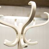 Parrot wears white Baumann coat 1970