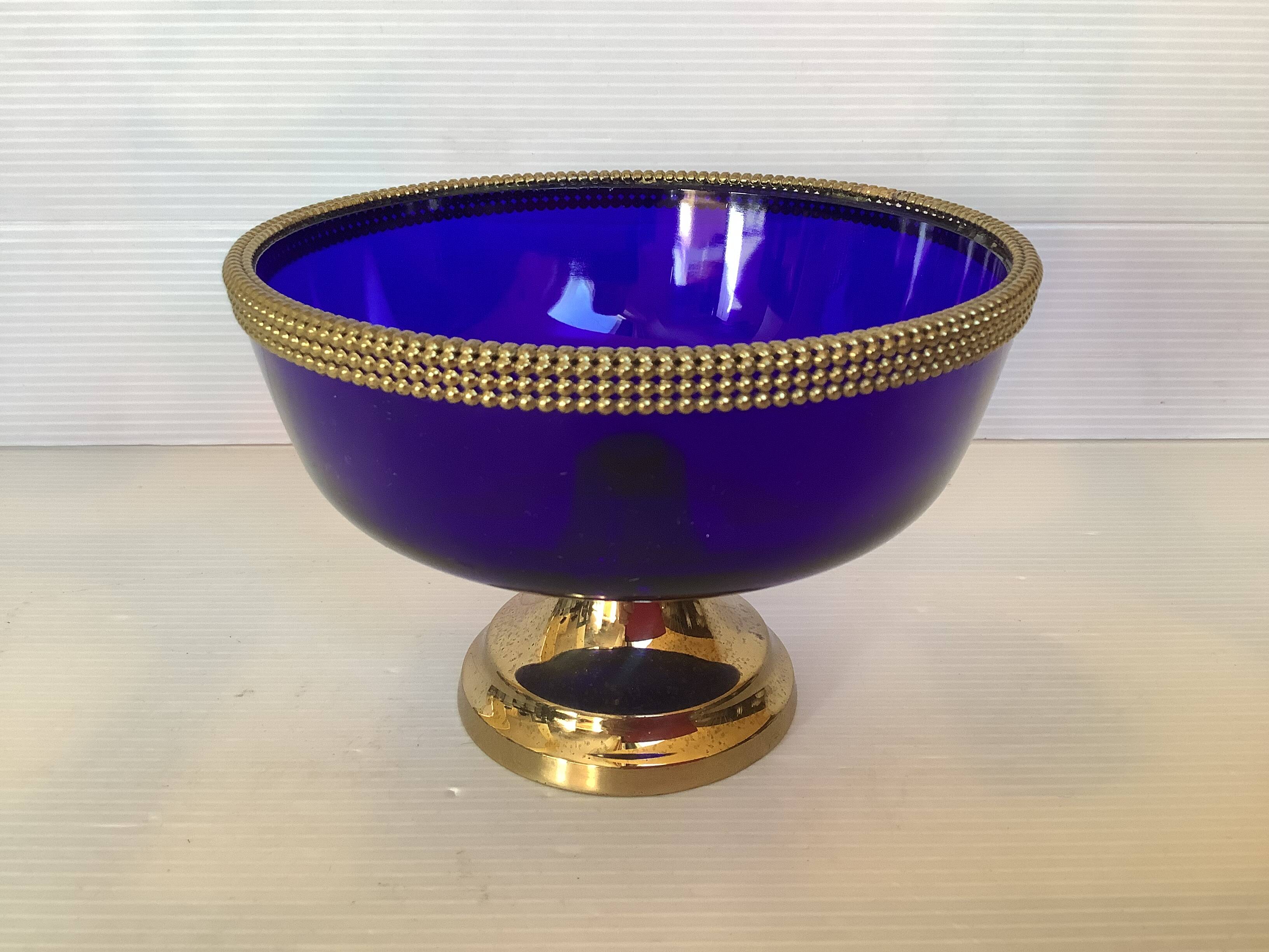 Cobalt blue trinket dish with a beaded pattern.