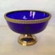 Cobalt blue trinket dish with a beaded pattern.
