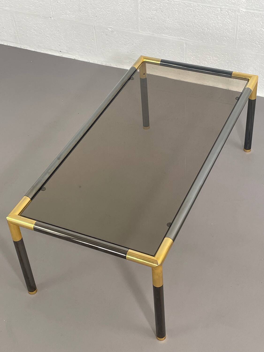 Gunmetal gold metal and smoked glass coffee table from the 70s