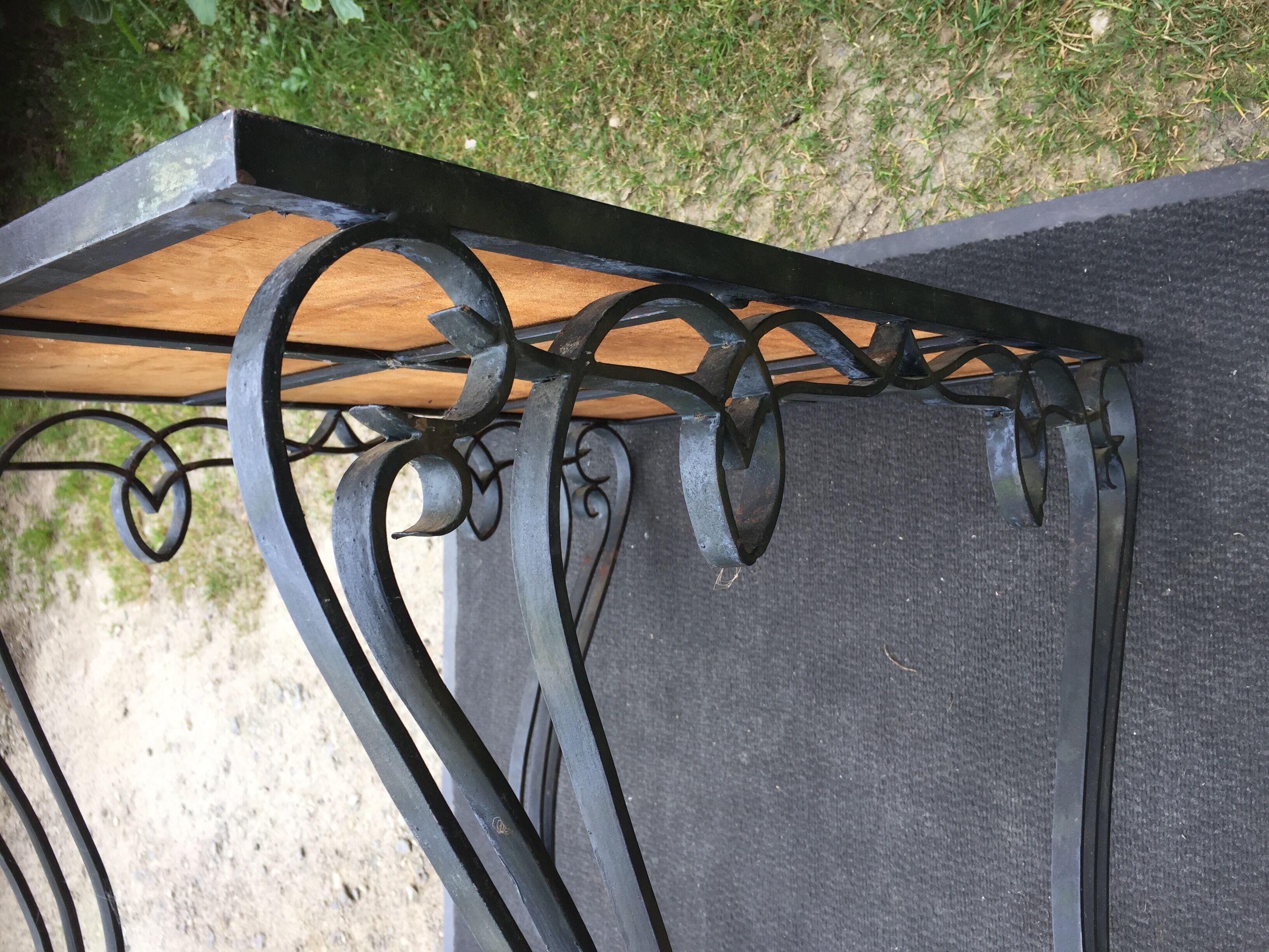 Vintage ceramic coffee table by Guy Trévoux with wrought iron base.