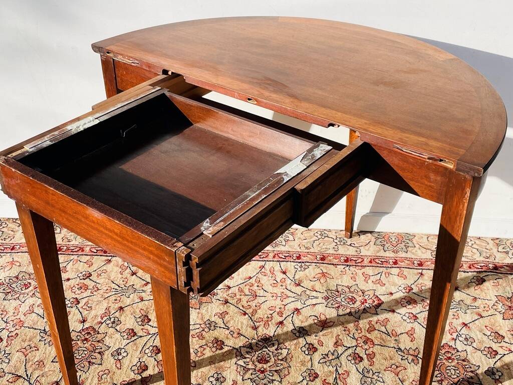 Empire-style demi-lune console from the 19th century.