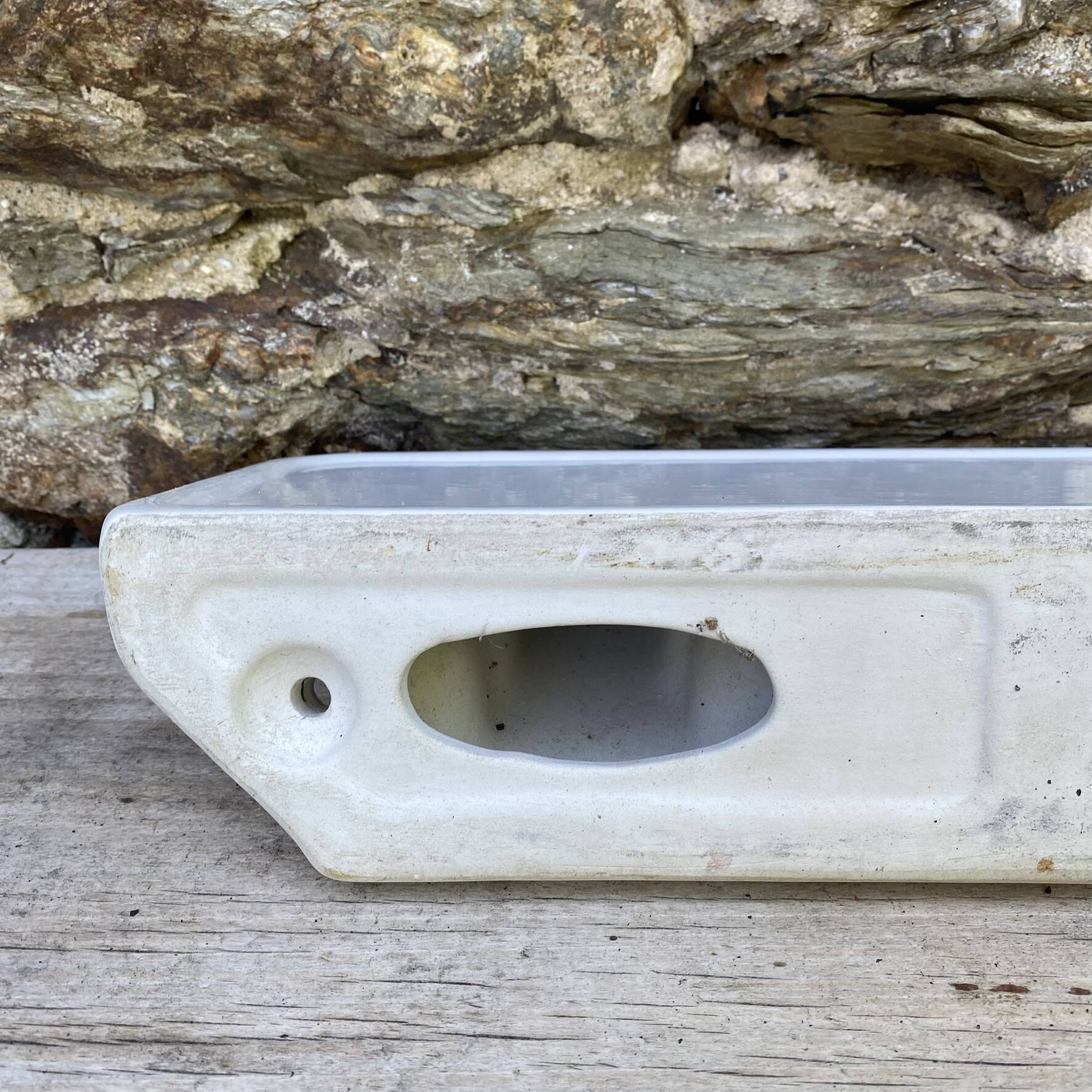 Antique wall shelf for bathroom in white porcelain.