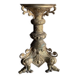 Large bronze candlestick with tripod and winged dog decoration, 19th century.