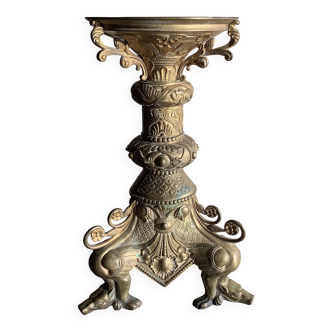 Large bronze candlestick with tripod and winged dog decoration, 19th century.