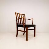 Mid-century armchair by Ole Wanscher for Fritz Hansen, stained beech and leather.