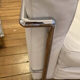 Pair of white leather and chrome armchairs