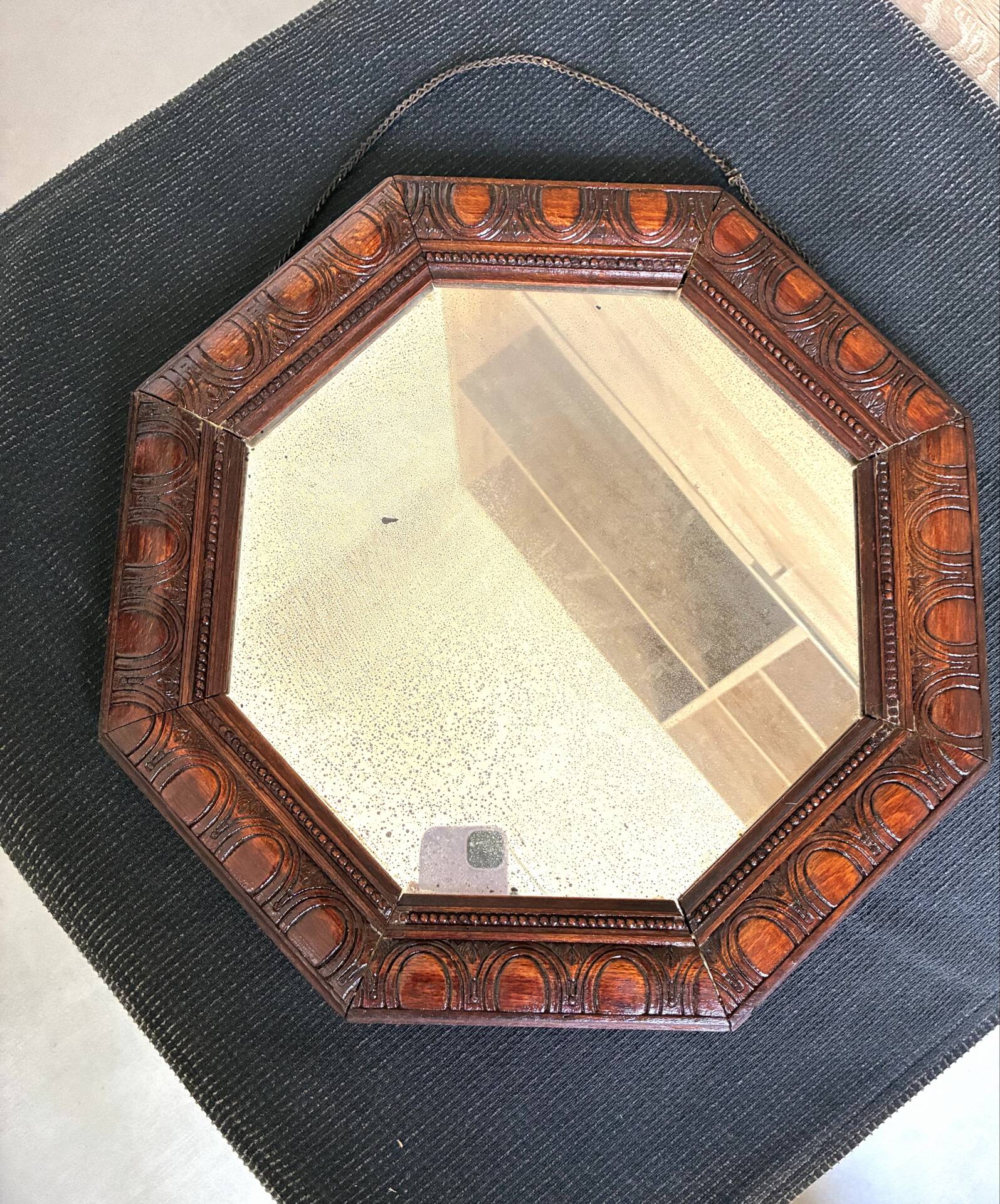 Octagonal mirror, glossy varnished oak, Art Deco.