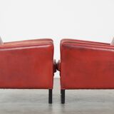 Set of 2 red-colored design armchairs made of sheepskin leather