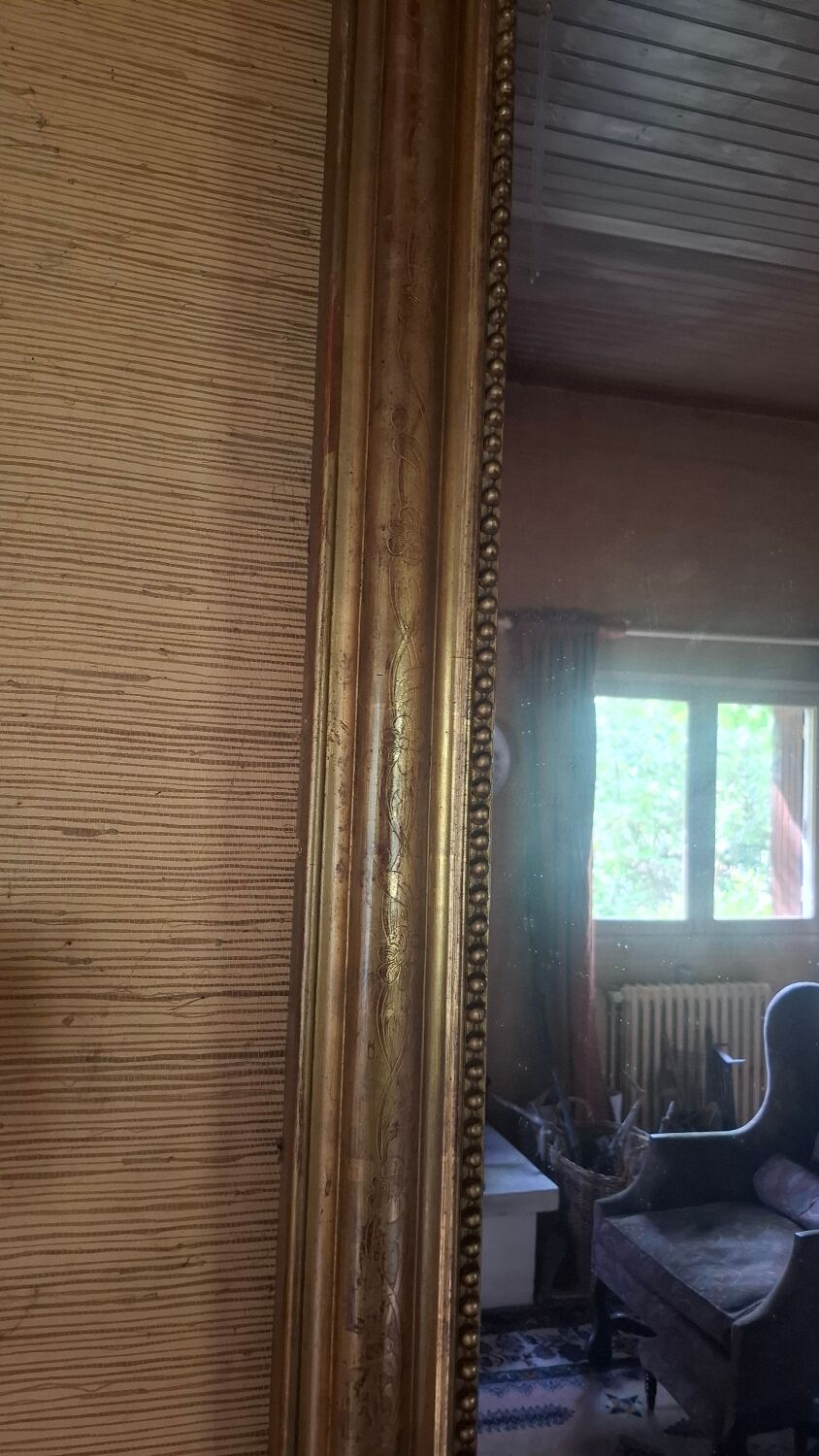 Large Louis Philippe mirror with a gilded wooden frame.