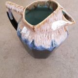 Enamelled ceramic broc