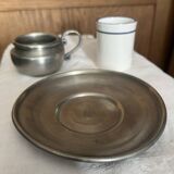 Pewter and porcelain cup and saucer