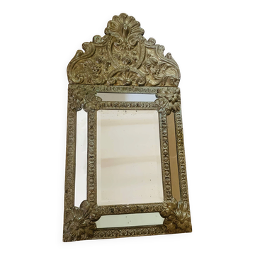 Small mirror with repoussé brass frame.